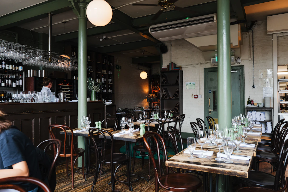 Warm restaurant interior set for dining