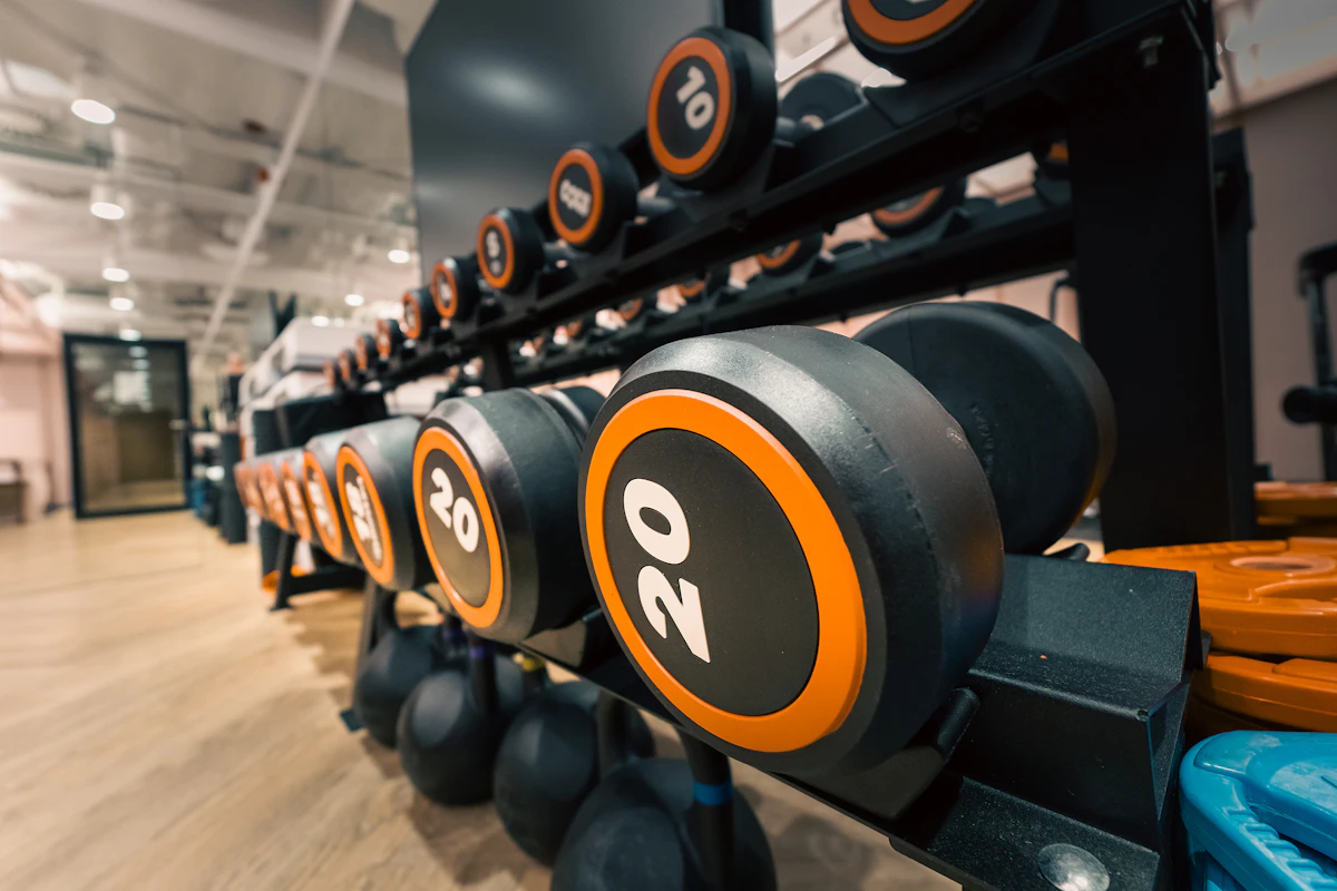 Dumbbells and strength-training equipment in a gym